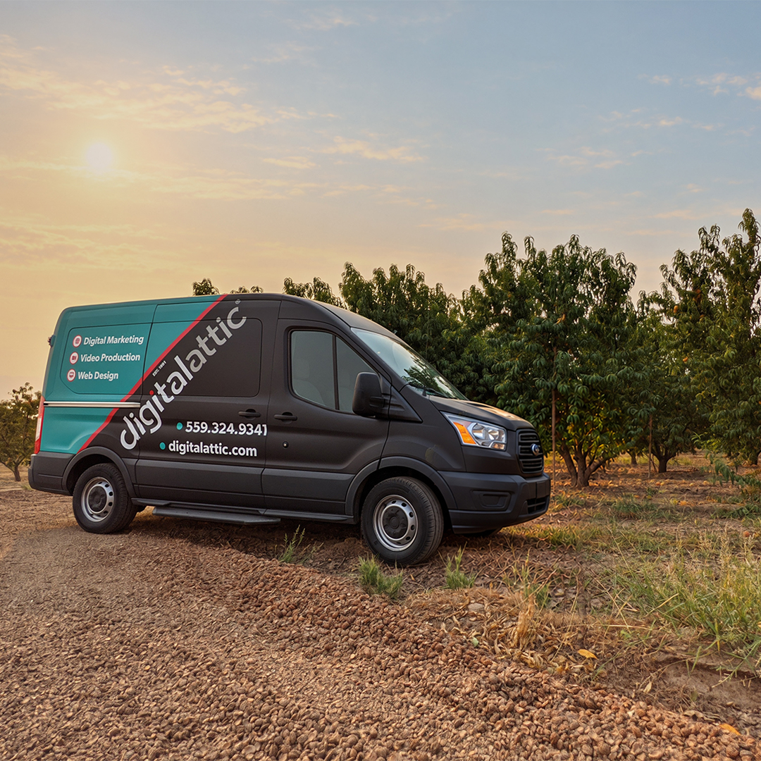 Digital Attic van parked in a Central Valley orchard at sunset