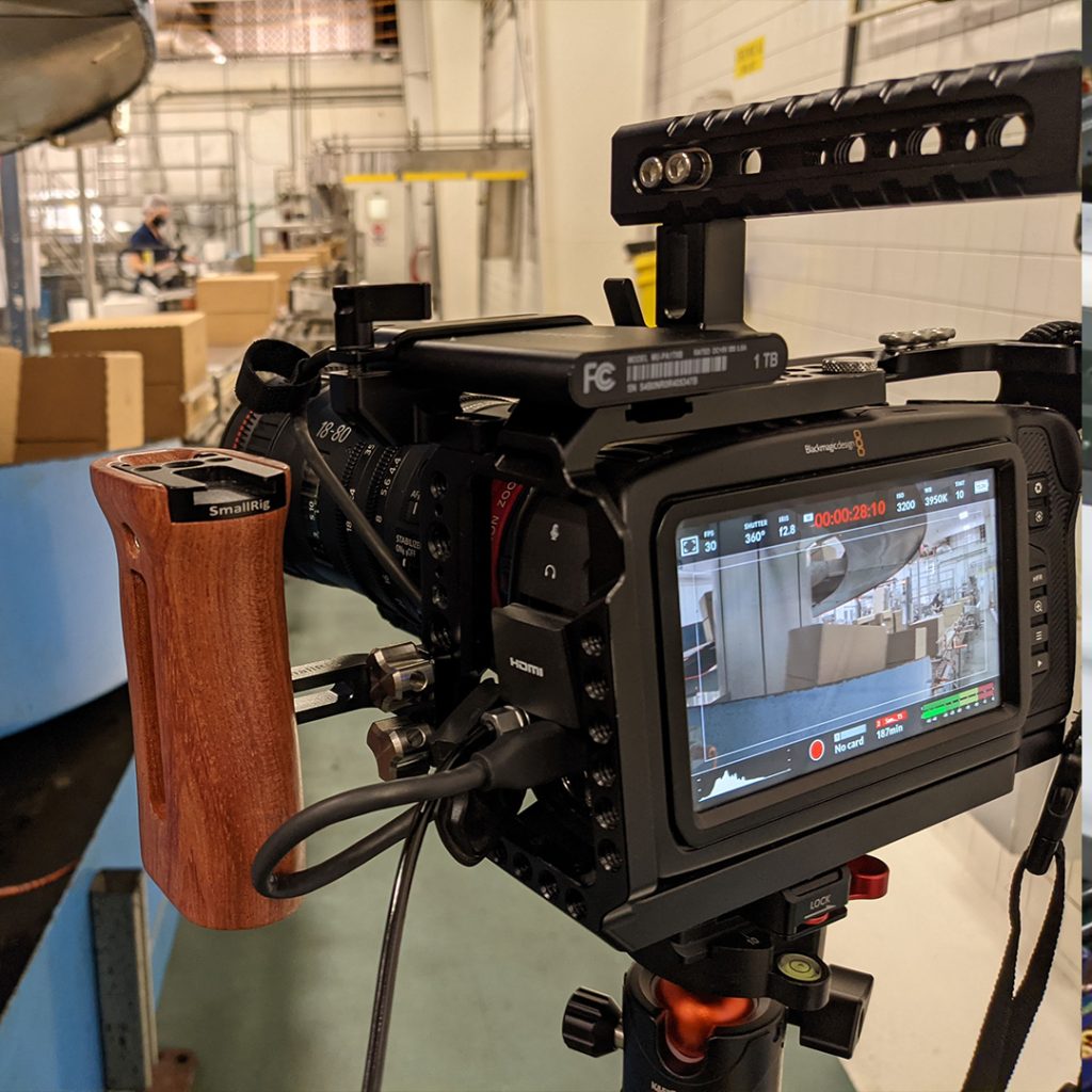 Cinema camera filming inside a packing facility